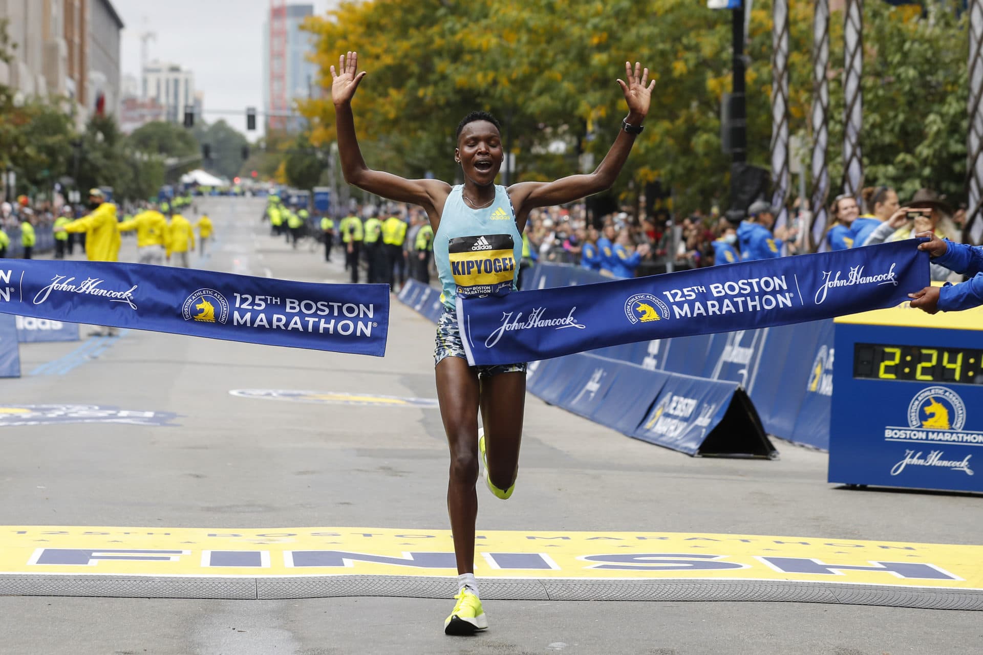 Diana Kipyogei, of Kenya, hits the tape to win the women's division of the 125th Boston Marathon. (Winslow Townson/AP)