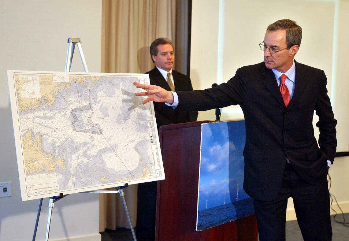 Cape Wind's Jim Gordon gestures toward a nautical chart of the project as GE's Steven Zwolinski looks on during a 2002 press conference. (Patrick Whittemore/Boston Herald via Getty Images)