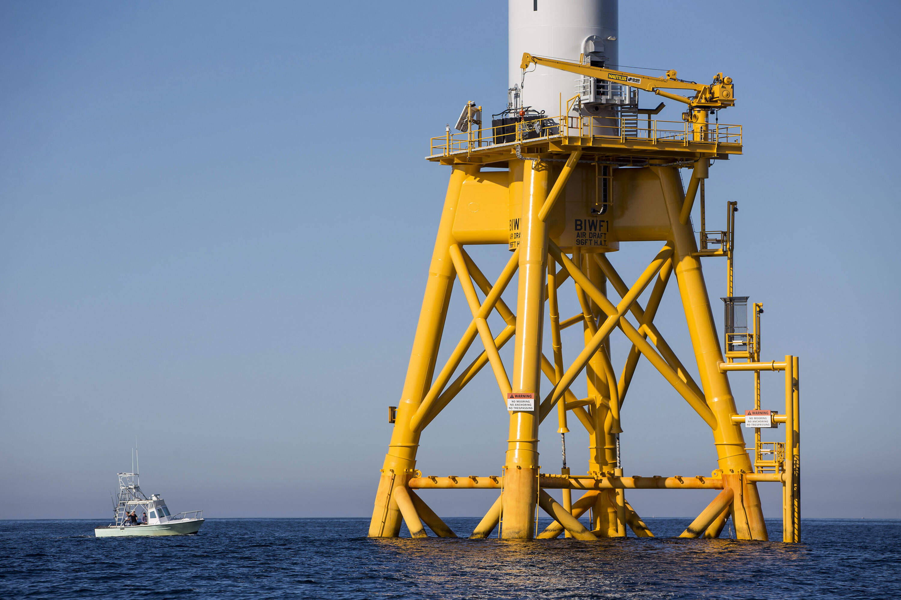 A fishing boat passes by the GE-Alstom Block Island Wind Farm. (Photo by Scott Eisen/Getty Images)
