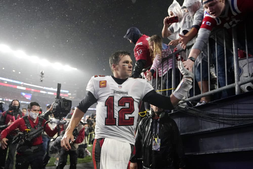 Tampa Bay Buccaneers quarterback Tom Brady (12) is congratulated by fans after defeating the New England Patriots 19-17 in an NFL football game on Sunday in Foxborough, Mass. (Steven Senne/AP)
