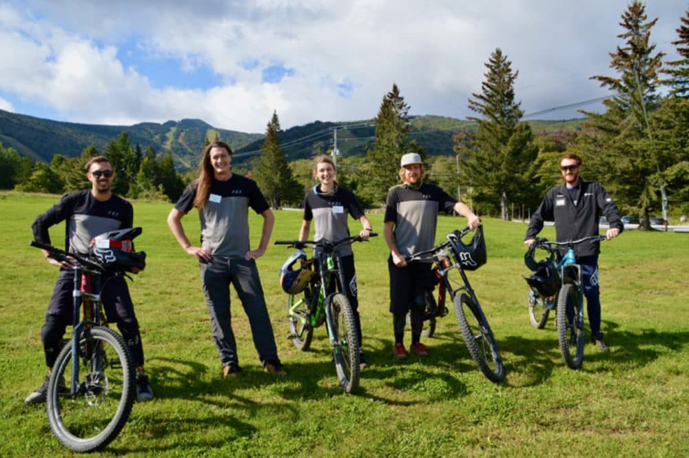 From left, Killington mountain bike coaches Peter Davenport, Chris Carter, Kate Oster, Ian Boyle and Jake Wlochowski. The group appreciated this year's higher wages, but said professional development opportunities often mean as much if not more to employees. (Nina Keck/VPR)
