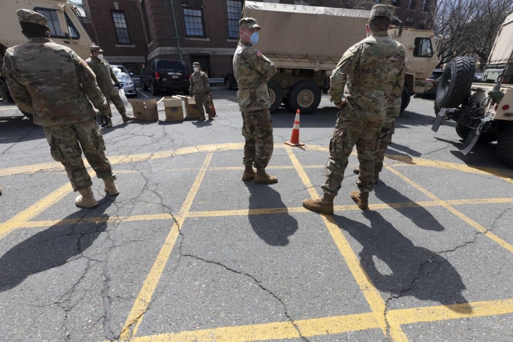 Massachusetts National Guard soldiers help with logistics in April 2020 file photo, at a food distribution site in Chelsea, Mass. (Michael Dwyer/AP)