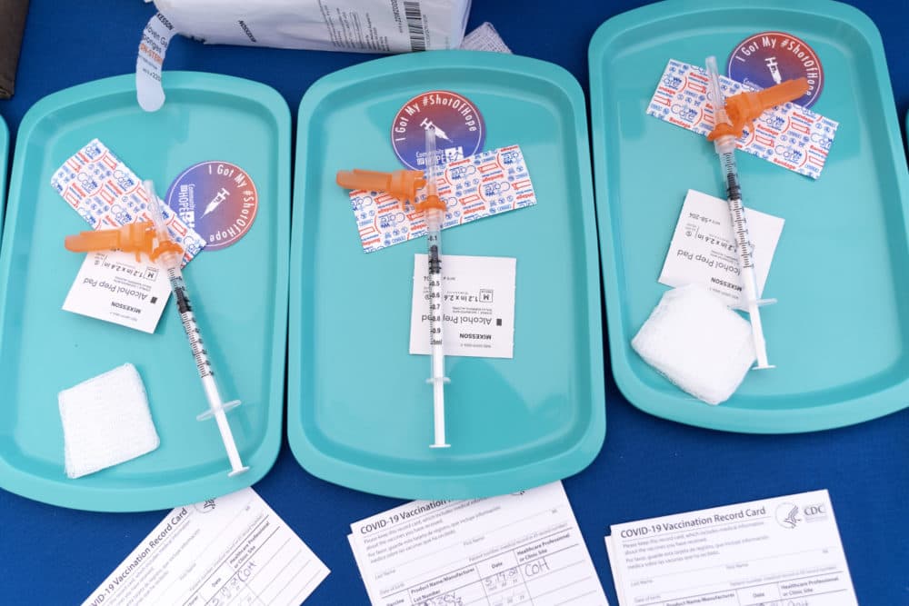 In this May 2021 file photo, Pfizer COVID-19 vaccine doses are prepared for members of the community 12 years and up, at a clinic in southeast Washington. (Jacquelyn Martin/AP)