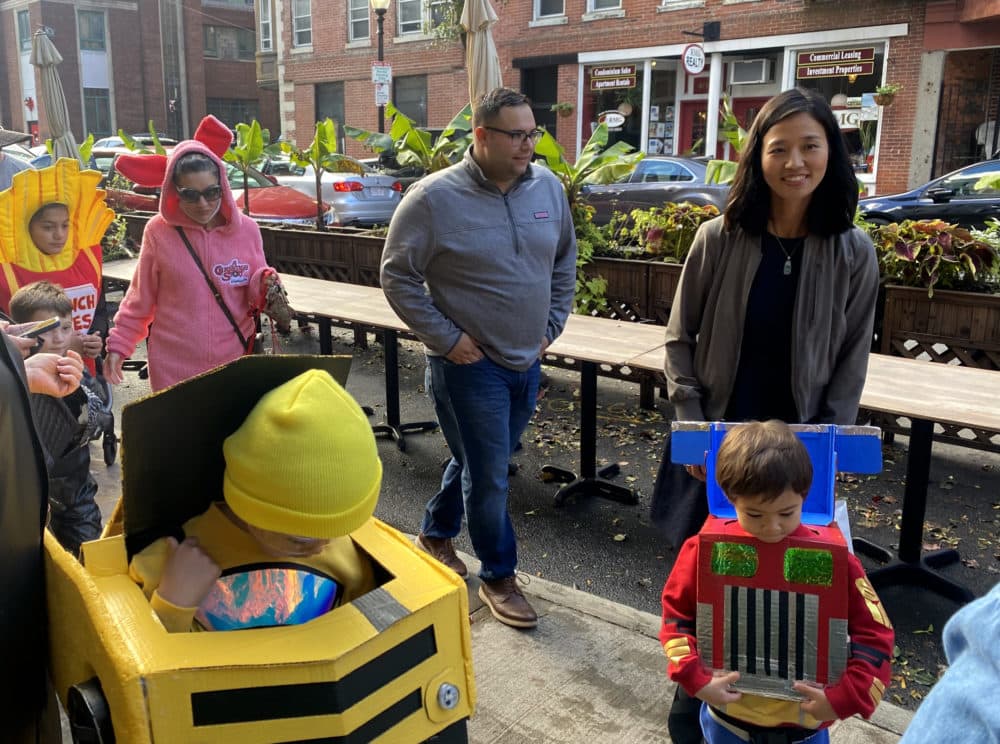 Michelle Wu and her family join a Halloween event in the North End on Sunday afternoon. (Walter Wuthmann/WBUR)