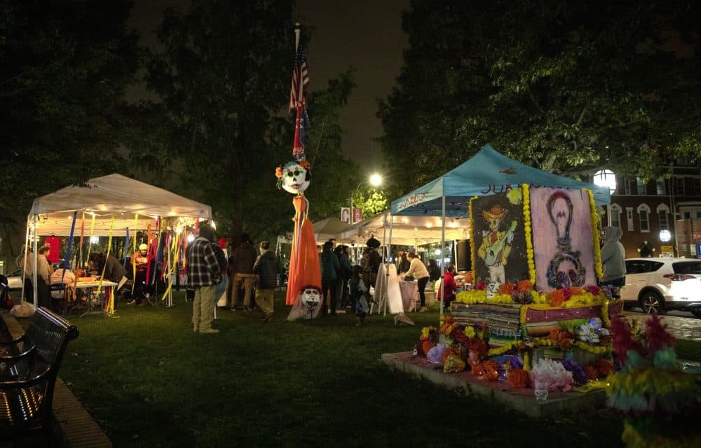 People gathered in Winnisimmet Park, Chelsea, for a mini-festival in honor of Día de los Muertos. (Robin Lubbock/WBUR)