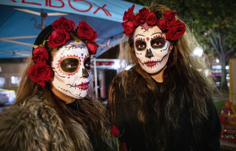 Cassandra Corona, Rebecca Gatgans, with faces painted as La Catrina, at a celebration of Día de los Muertos in Chelsea. (Robin Lubbock/WBUR)