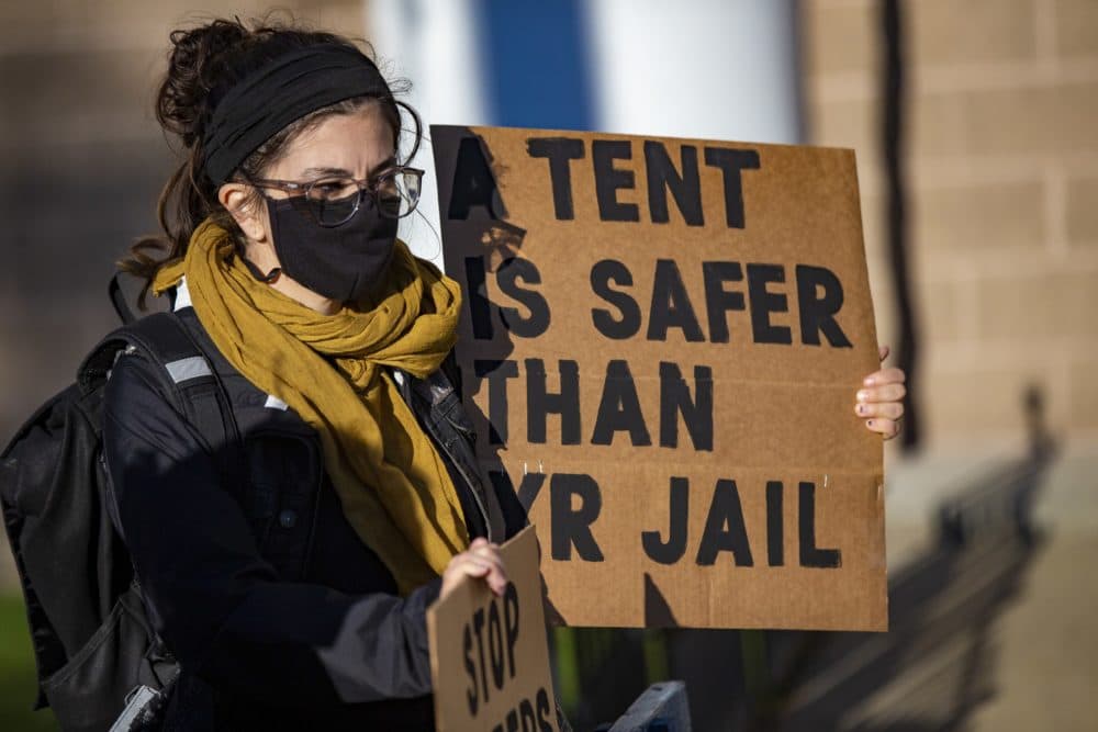 Demonstrators gathered outside the Suffolk County jail to protest the city's removal of people living in tents and the creation of a special court session to process people with outstanding warrants. (Jesse Costa/WBUR)
