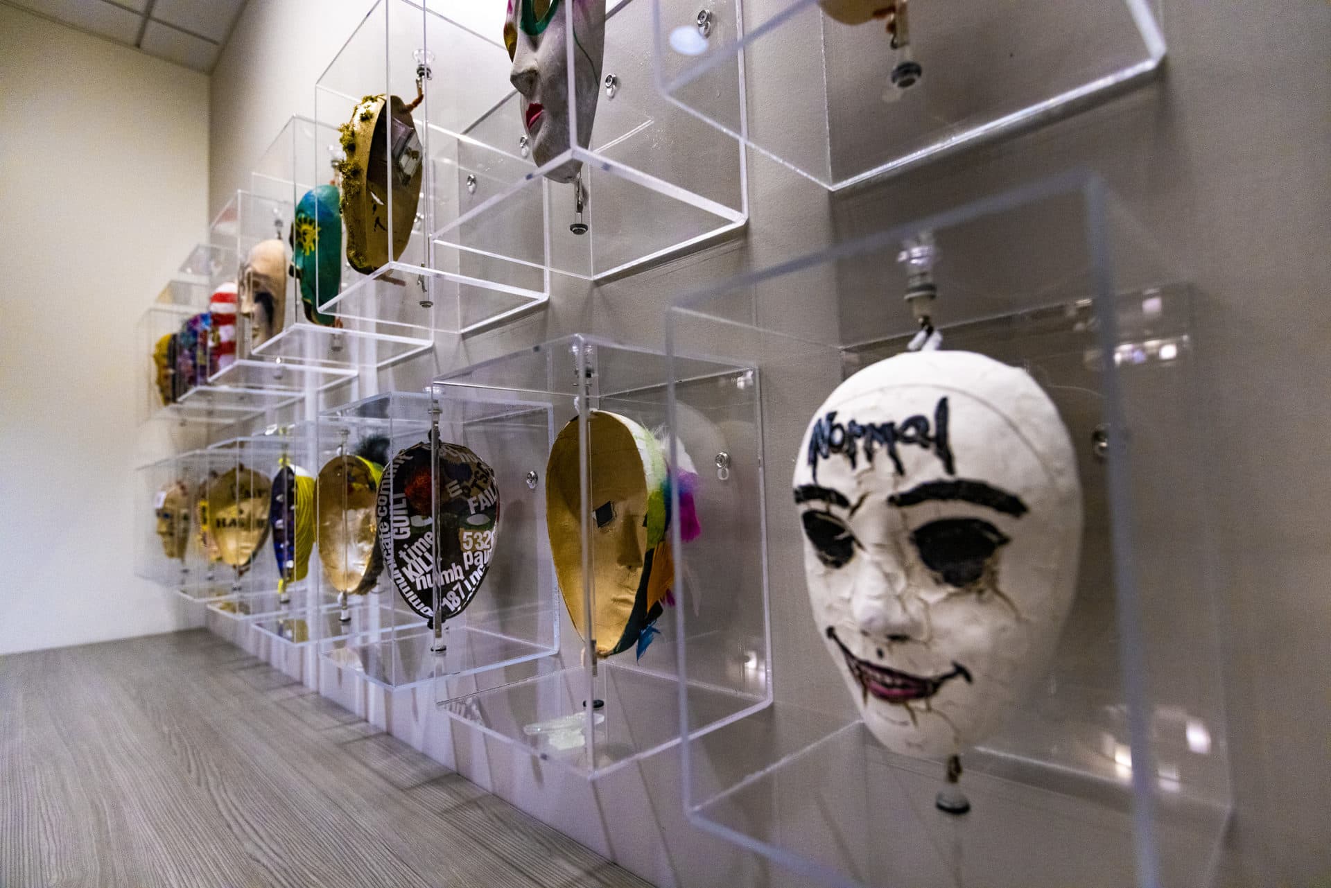 Home Base has an art therapy program during which veterans paint masks. The outside of the mask represents how they project themselves to the world, the inside represent their feelings and experiences. (Jesse Costa/WBUR)