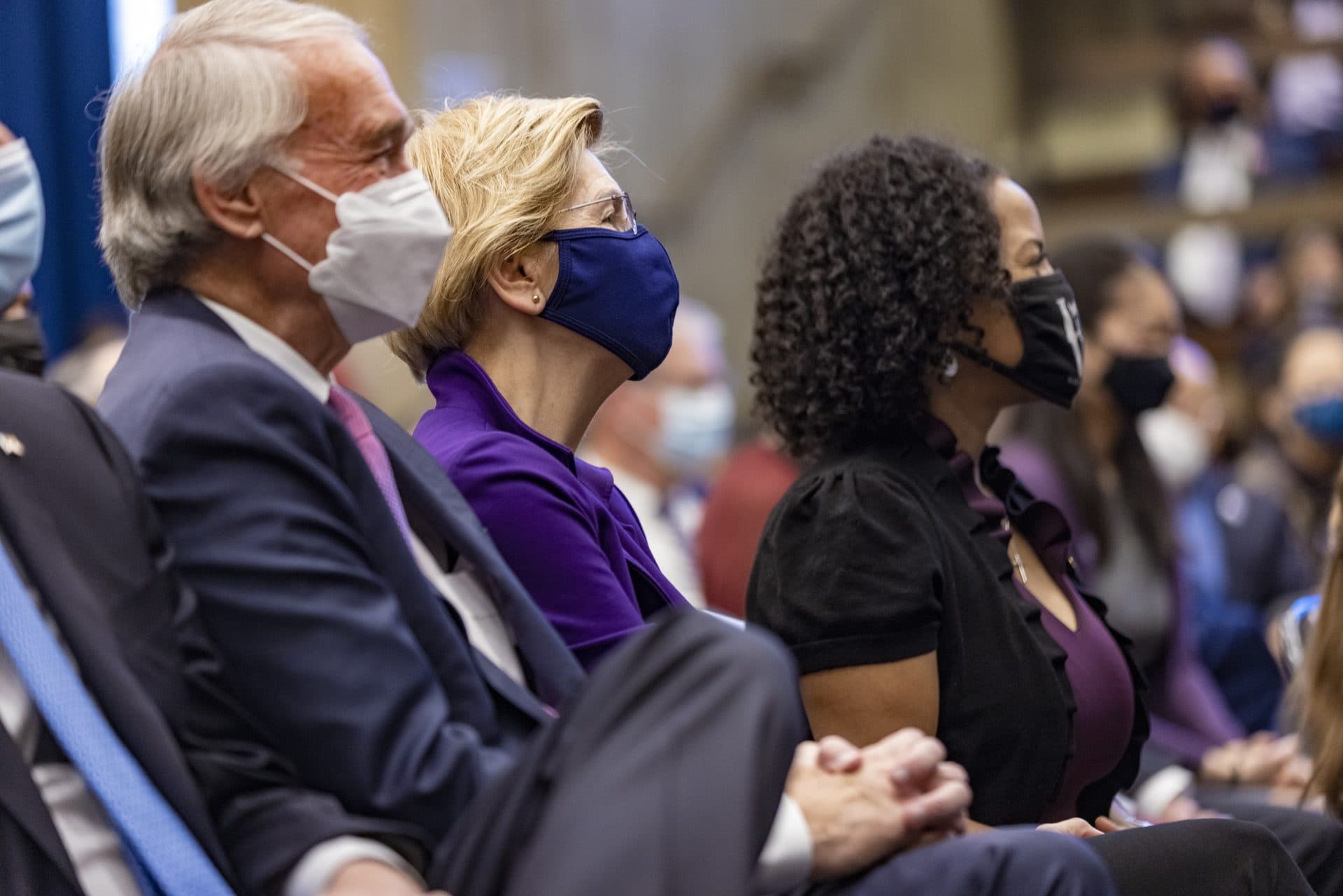 U.S. Sens. Edward Markey and Elizabeth Warren and former Acting Mayor Kim Janey listen as Mayor Michelle Wu speaks. (Jesse Costa/WBUR)