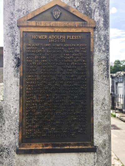 This June 3, 2018 photo shows a marker on the burial site for Homer Plessy at St. Louis No. 1 Cemetery in New Orleans. (Beth J. Harpaz/AP)