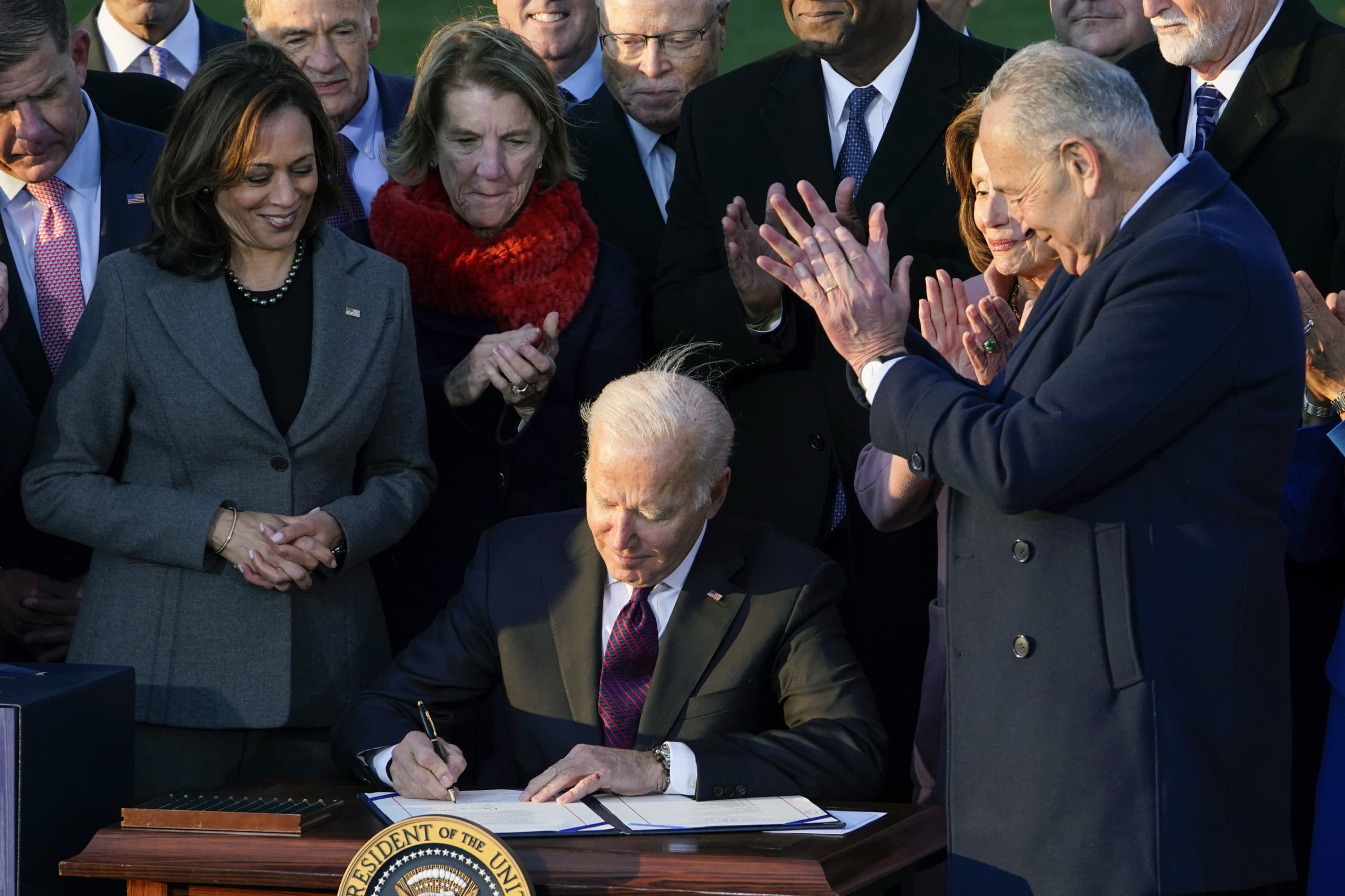 President Biden signs the $1.2 trillion bipartisan infrastructure bill into law during a ceremony on the South Lawn of the White House in Washington, Monday, Nov. 15, 2021. (Susan Walsh/AP)