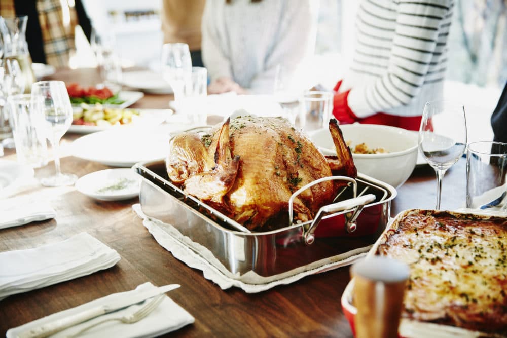 Turkey in roasting pan on table for a Thanksgiving meal. (Getty Images)