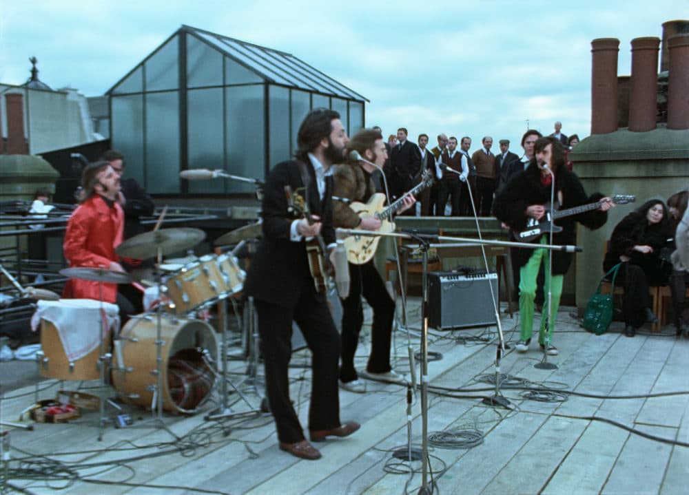 A still of the rooftop performance in &quot;The Beatles: Get Back.&quot; (Courtesy of Apple Corps Ltd.)
