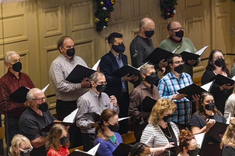 Jesse Liu, top center row, rehearses with the rest of the Tanglewood chorus and Boston Pops for the Holiday Pops concerts. (Jesse Costa/WBUR)