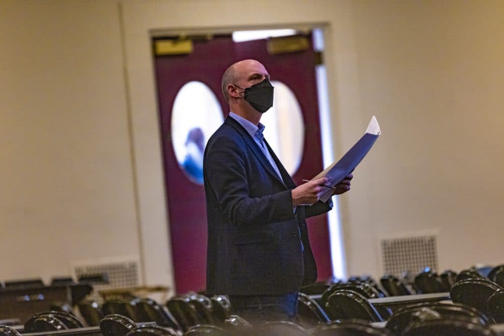 BSO choral director James Burton reviews the score and listens as the Tanglewood chorus rehearse. (Jesse Costa/WBUR)