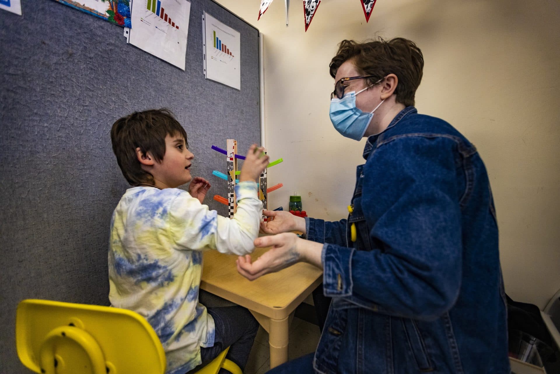 Teacher Kate McDermott plays an imitation game with a student at the New England Center for Children in Southborough. (Jesse Costa/WBUR)