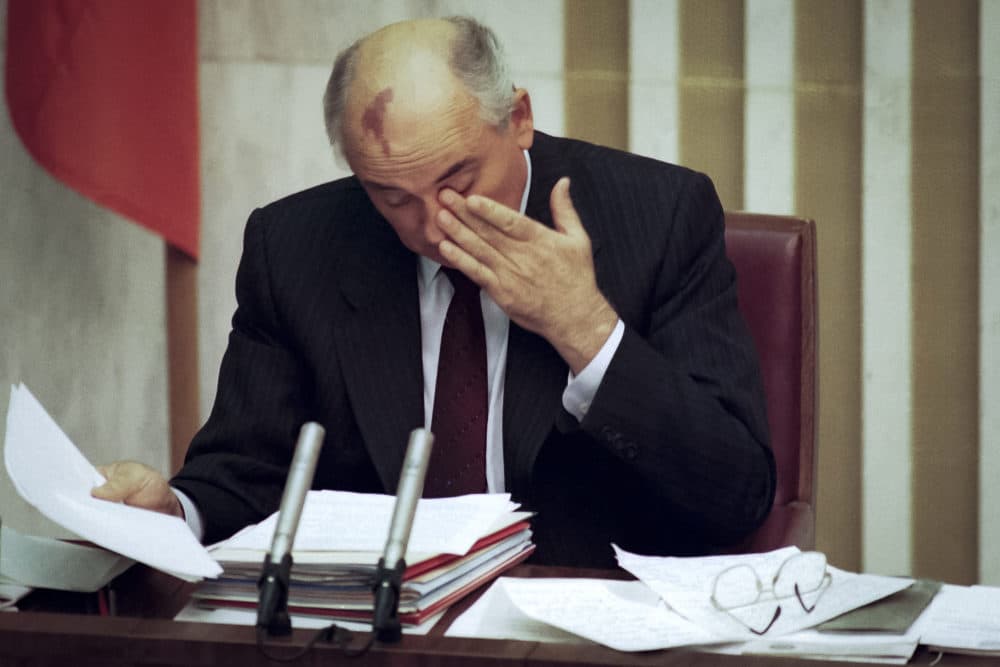 Aug. 27, 1991: Soviet President Mikhail Gorbachev rubs his eyes, seemingly exhausted from the grueling special session of the Supreme Soviet as he threatens to resign if the Soviet Union falls apart in Moscow. (Alexander Zemlianichenko/AP)