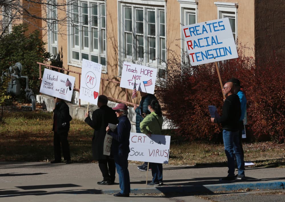 People protest outside the offices of the New Mexico Public Education Department's office in Albuquerque, New Mexico. Supporters say the new curriculum, which includes ethnic studies, is &quot;anti-racist.&quot; (Cedar Attanasio/AP Photo)