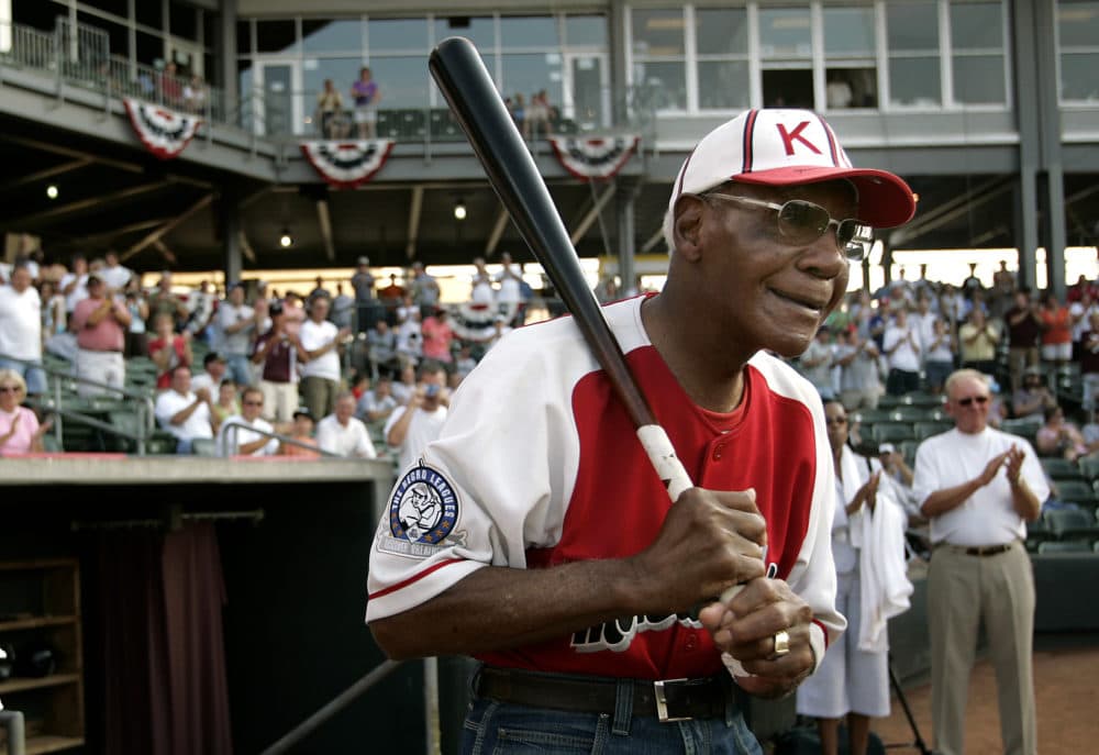 Buck O'Neil walks to the field as he is introduced before a minor league all-star game on July 18, 2006, in Kansas City, Kan. (Charlie Riede/AP/File)