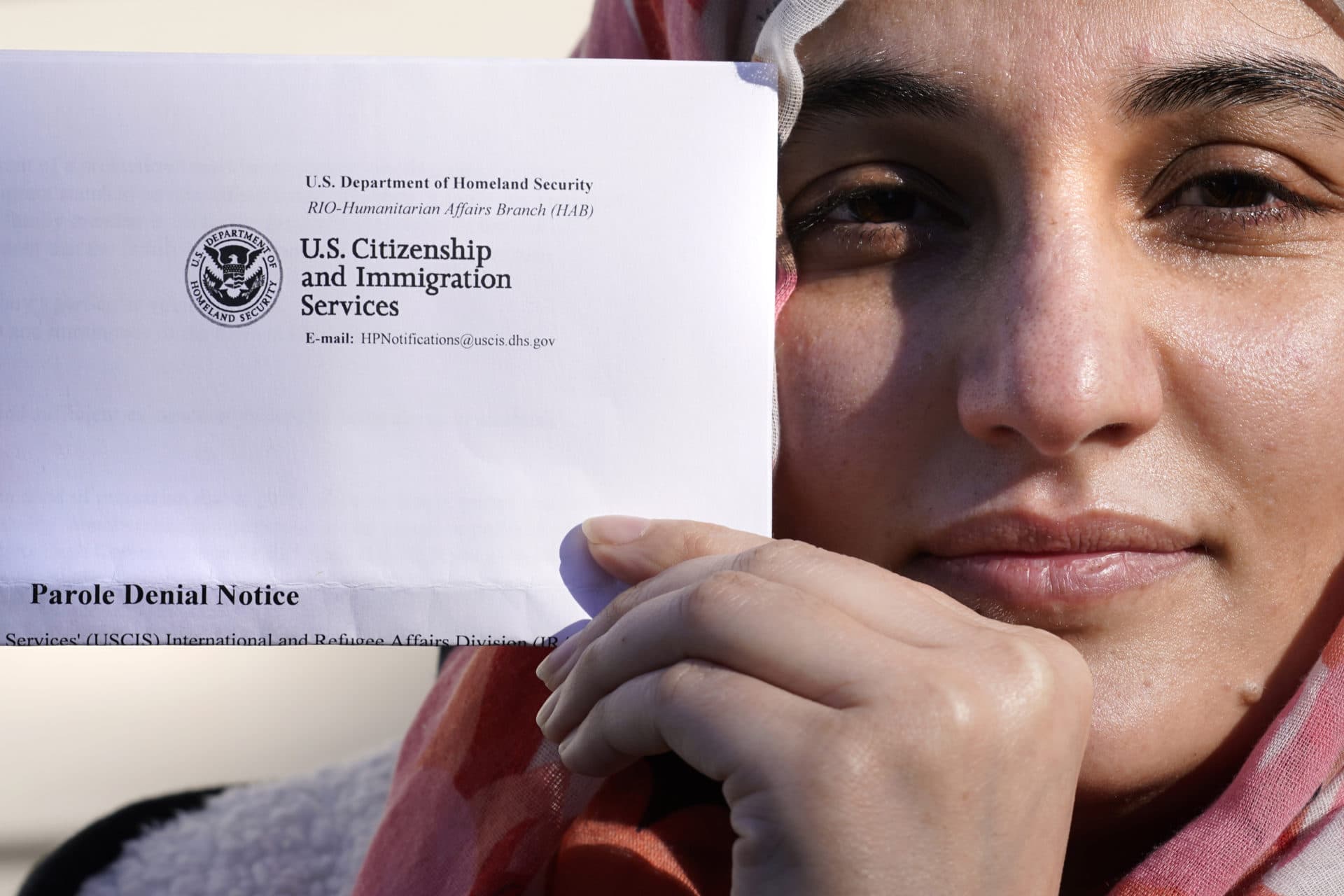 Haseena Niazi received the letter from the federal government denying her fiancé's humanitarian parole application earlier in the month. Her fiance, who she asked not to be named over concerns about his safety, had received threats from Taliban members for working on women's health issues at a hospital north of Kabul. (Charles Krupa/AP)