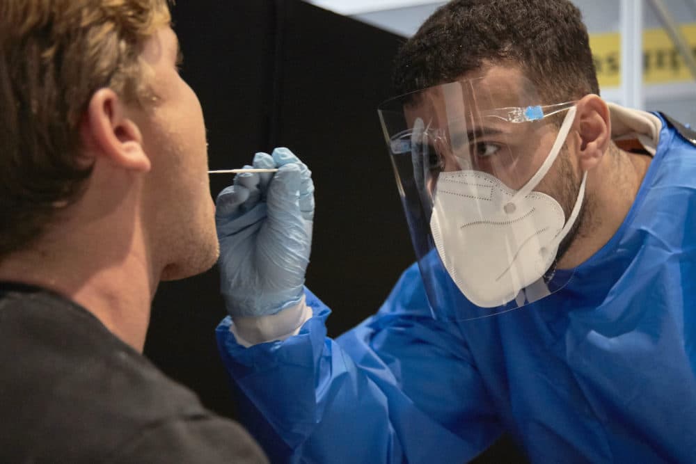 The passenger of a flight from South Africa is tested for the coronavirus at Amsterdam Schiphol airport on Dec. 2, 2021 in Amsterdam, Netherlands. (Pierre Crom/Getty Images)