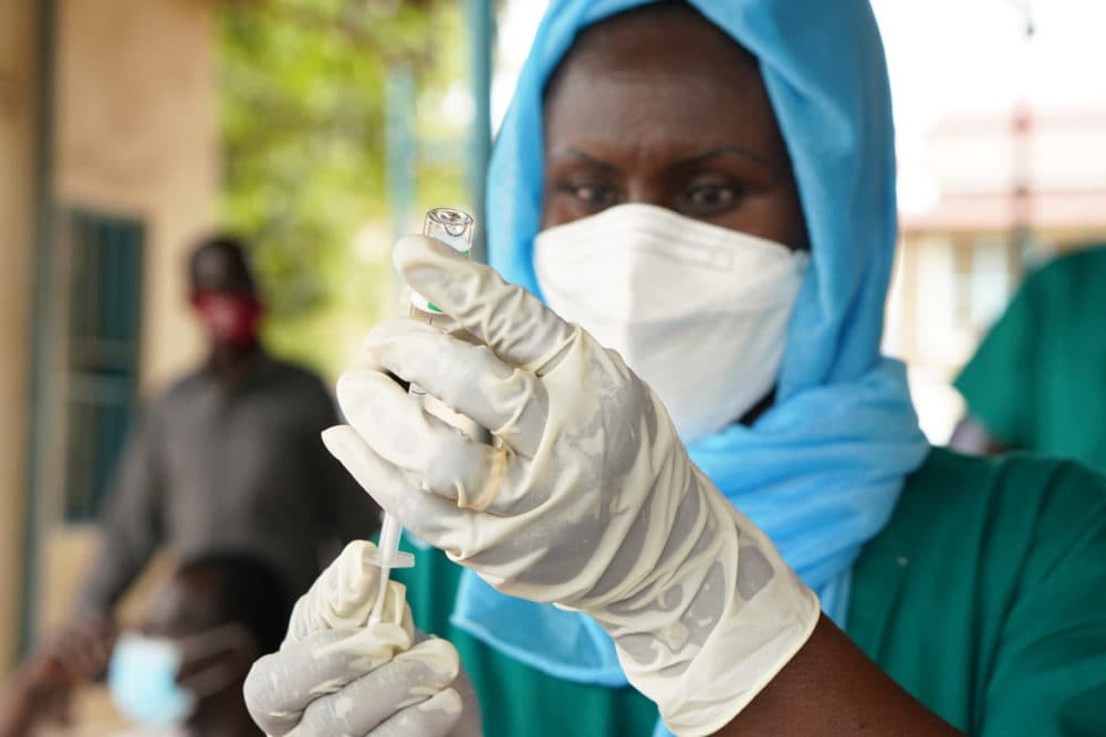 A health care worker prepares to administer a vaccine for COVID-19 at the Police Hospital, on April 7, 2021 in Juba, South Sudan. (Andreea Campeanu/Getty Images)