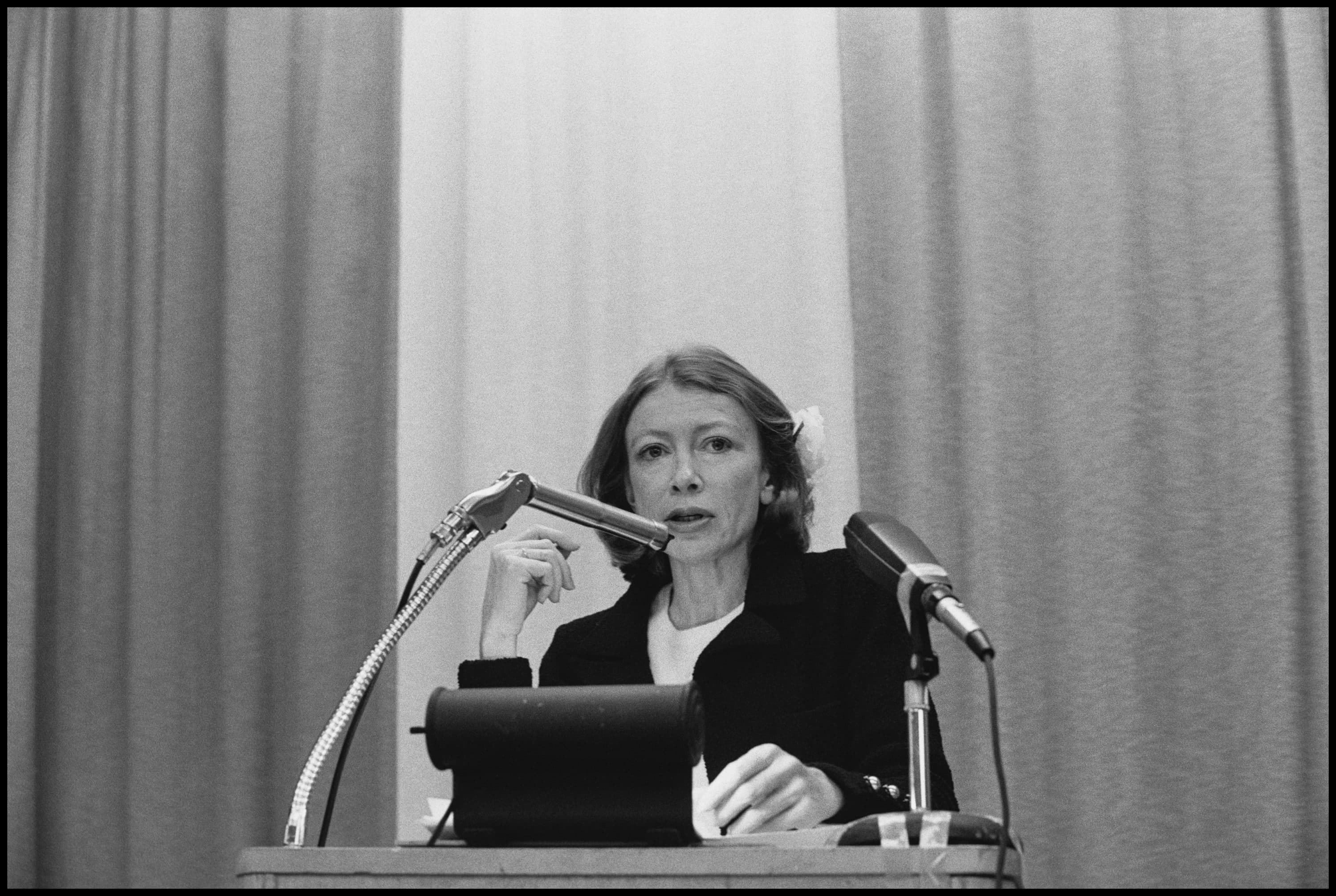 Joan Didion chronicled what was being lost, writes Julie Wittes Schlack, even while acknowledging that she was grieving for something that may not ever have existed. The author died Thursday at the age of 87. In this photo, Didion speaks at the College of Marin, Kentfield, California, February 1977. (Janet Fries/Getty Images)