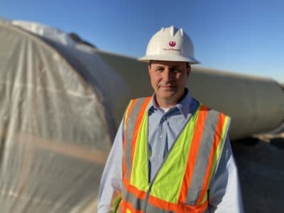 City of Phoenix Water Services Director Troy Hayes stands next to 66-inch steel and concrete pipes. The new $280 million Phoenix Drought Pipeline will make sure 400,000 residents will have water if the Colorado River levels drop too low. (Peter O'Dowd/Here &amp; Now)