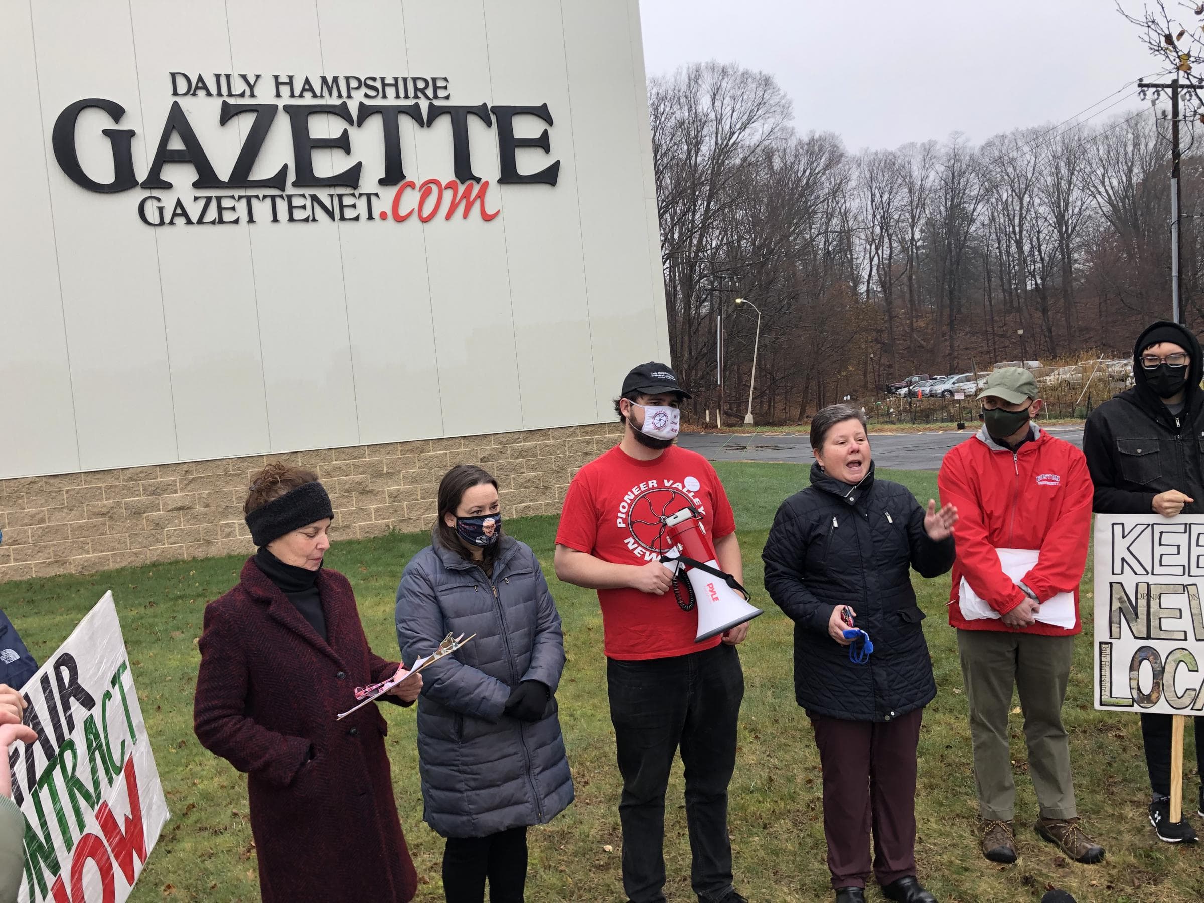 Massachusetts State Sen. Jo Comerford, who writes a monthly column for the Daily Hampshire Gazette, speaks outside the paper's headquarters in Northampton. (Alden Bourne/NEPM)