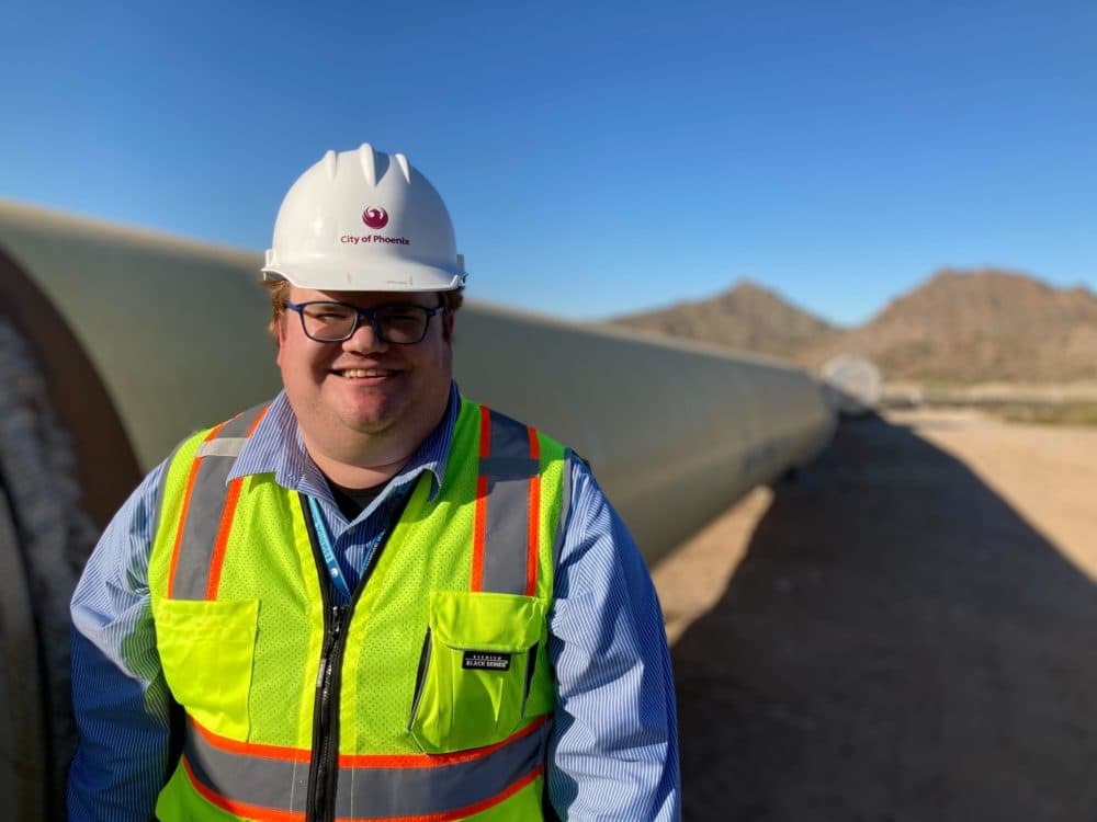 City of Phoenix engineer Clayton Freed stands next to 66-inch steel and concrete pipes. The new $280 million Phoenix Drought Pipeline will make sure 400,000 residents will have water if the Colorado River levels drop too low. (Peter O'Dowd/Here &amp; Now)