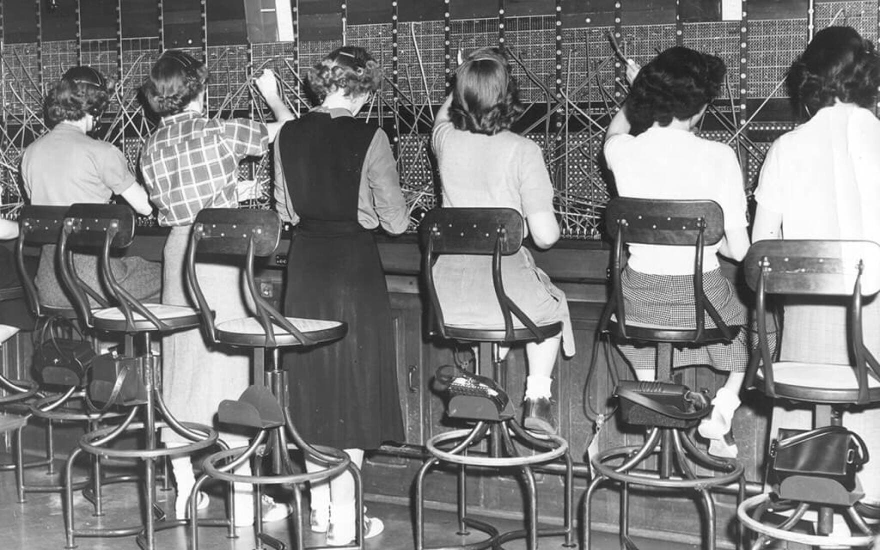 Operators have always been a fashionable lot. Note the bobby sox and saddle shoes. c. 1951. (Courtesy The Telecommunications History Group, Inc. via Maine Public)