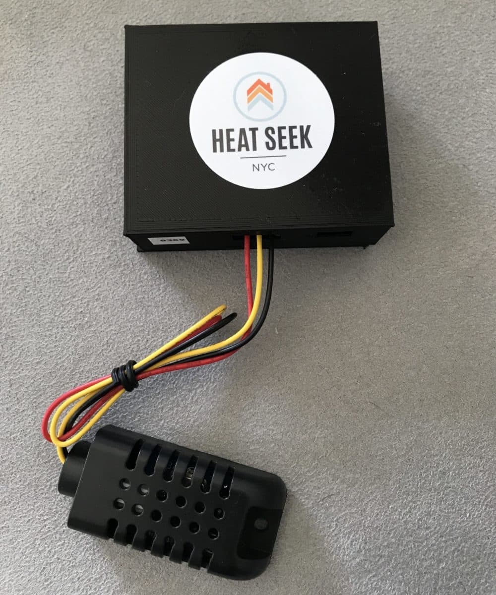 The circuitry for the Heat Seek sensor is contained in a plastic box (shown here with the Heat Seek logo on it) that is half the size of a deck of playing cards. Its thermometer is housed in a smaller, separate unit about the size of a human thumb. (Courtesy of Heat Seek)