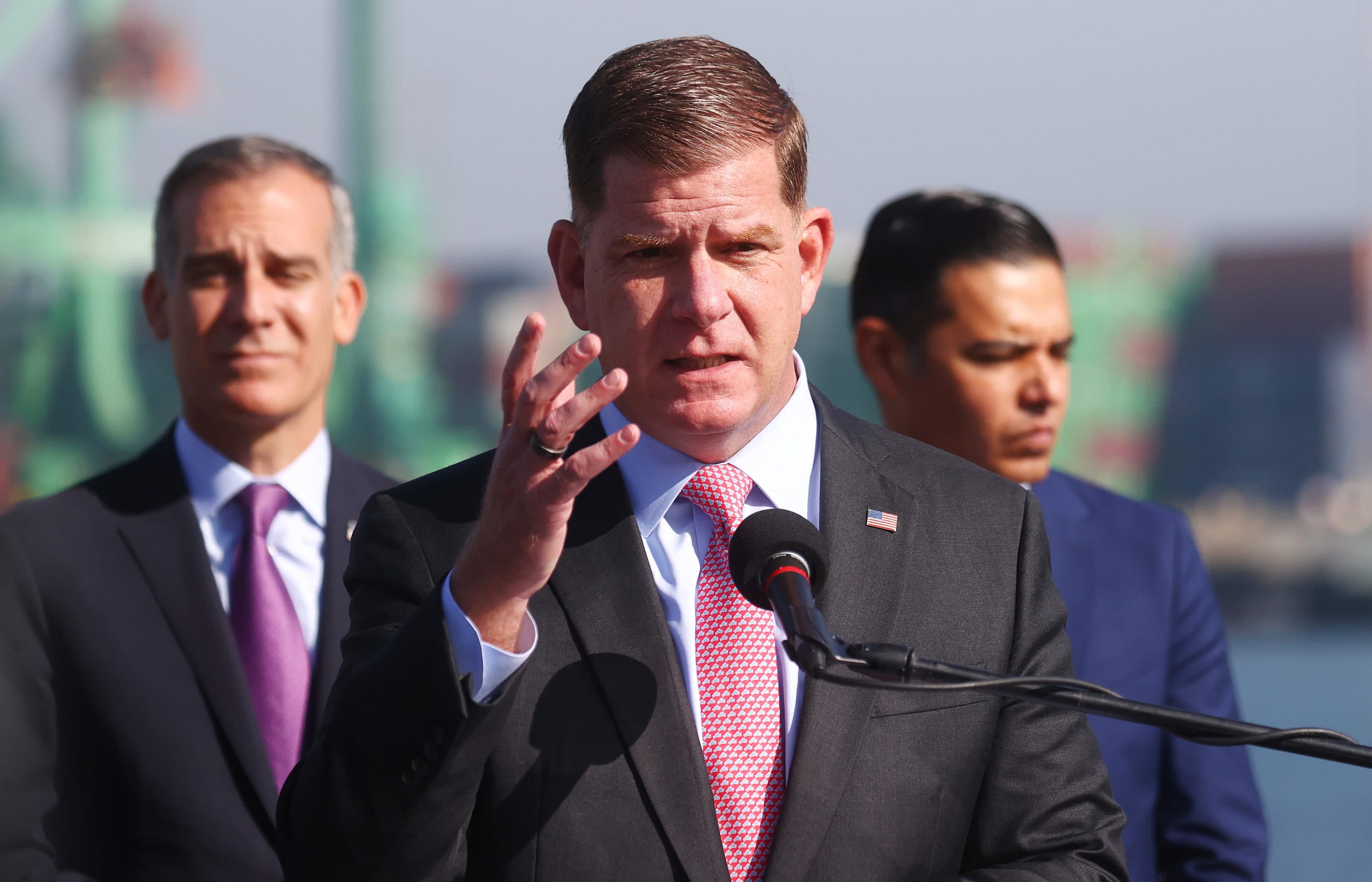 U.S. Secretary of Labor Marty Walsh (C) speaks as Los Angeles Mayor Eric Garcetti (L) and Long Beach Mayor Robert Garcia look on at a press conference on Nov. 30 in San Pedro, California. (Mario Tama/Getty Images)