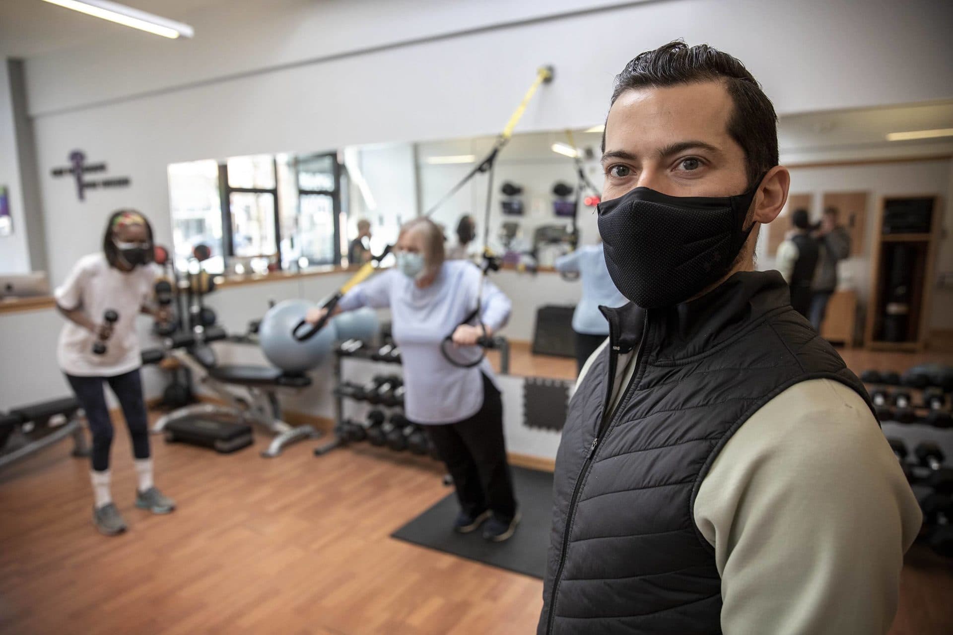 Personal trainer John Pecchia at Get In Shape For Women gym in Cambridge. (Robin Lubbock/WBUR)