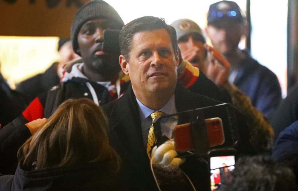 Republican Geoff Diehl stands with protesters during Boston Mayor Michelle Wu's press conference at City Hall, to discuss the response to the COVID-19 pandemic in Boston on Dec. 20, 2021. Wu announced a vaccine mandate to enter businesses in Boston. (Pat Greenhouse/The Boston Globe via Getty Images)