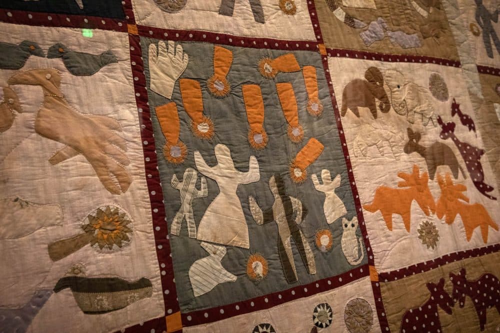 Detail from Harriet Powers' Pictorial Quilt (1895-98). This panel is believed to depict the Leonid meteor storm of 1833. From Powers' description of the quilt: &quot;The falling of the stars on Nov. 13, 1833. The people were frightened and thought that the end had come. God's hand staid the stars. The varmints rushed out of their beds.&quot; (Robin Lubbock/WBUR)