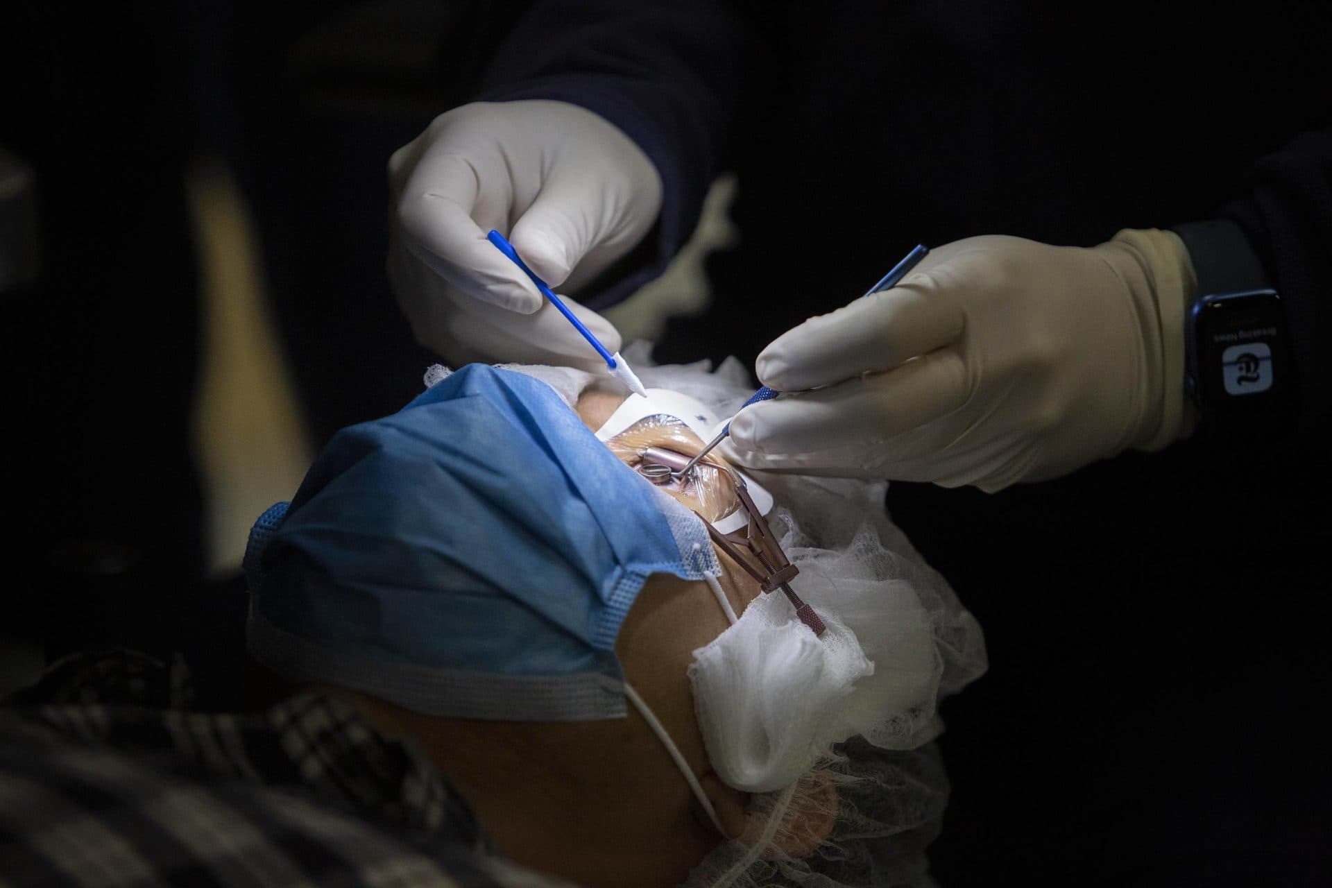 Dr. Samir Melki works on a laser assisted eye surgery patient. (Robin Lubbock/WBUR)
