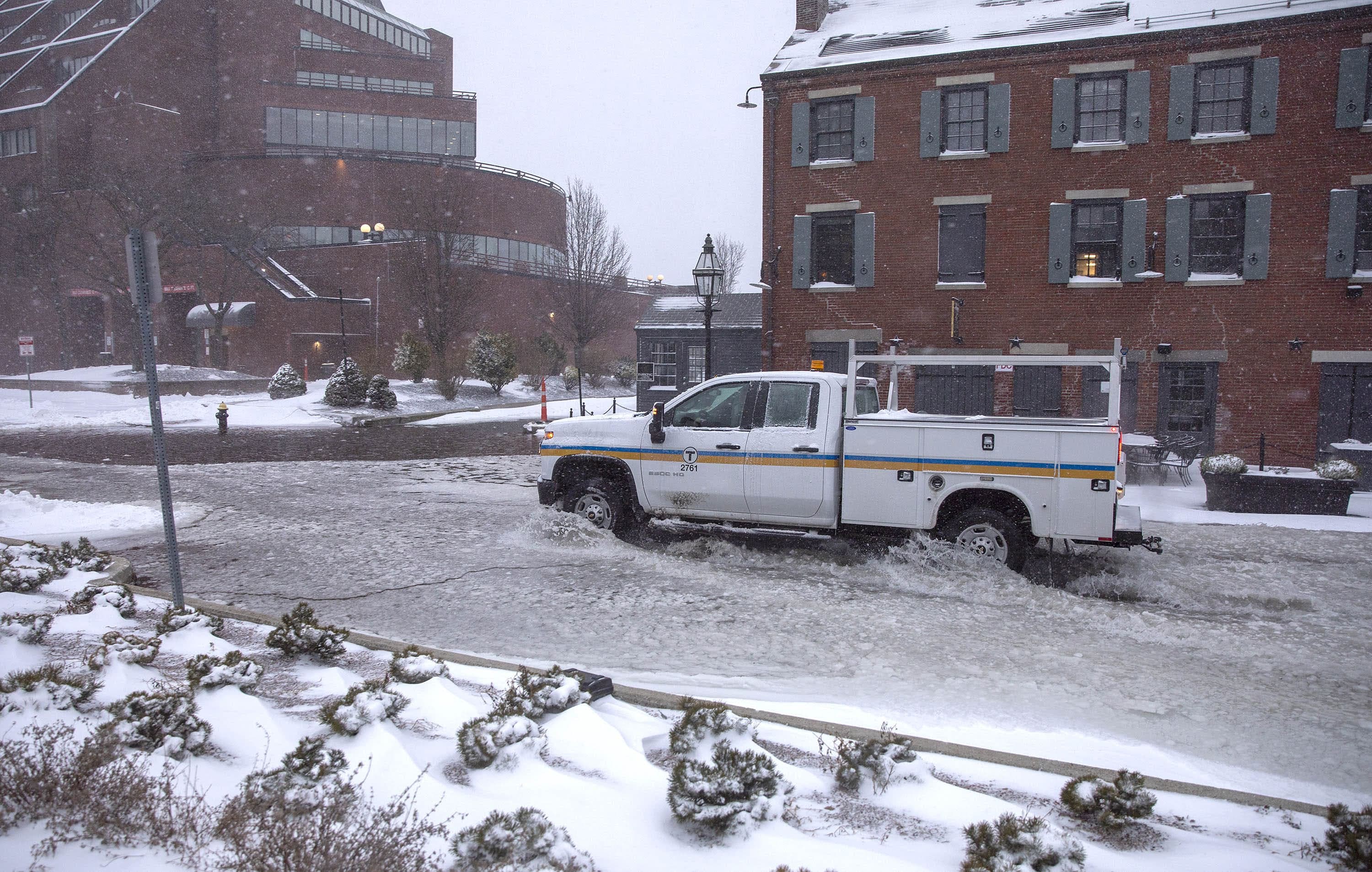 High tide early Saturday morning during the snowstorm creates flooding on Long Wharf by the Chart House. (Robin Lubbock/WBUR)