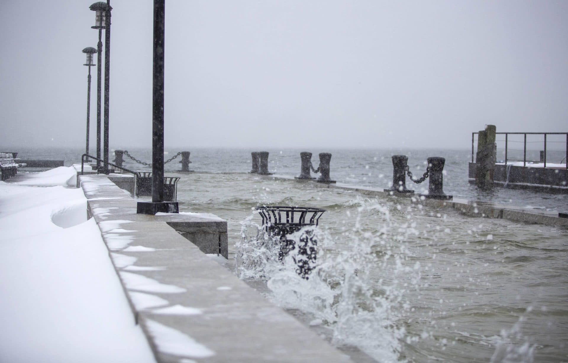 With snow falling, high tide covers the end of Long Wharf. (Robin Lubbock/WBUR)