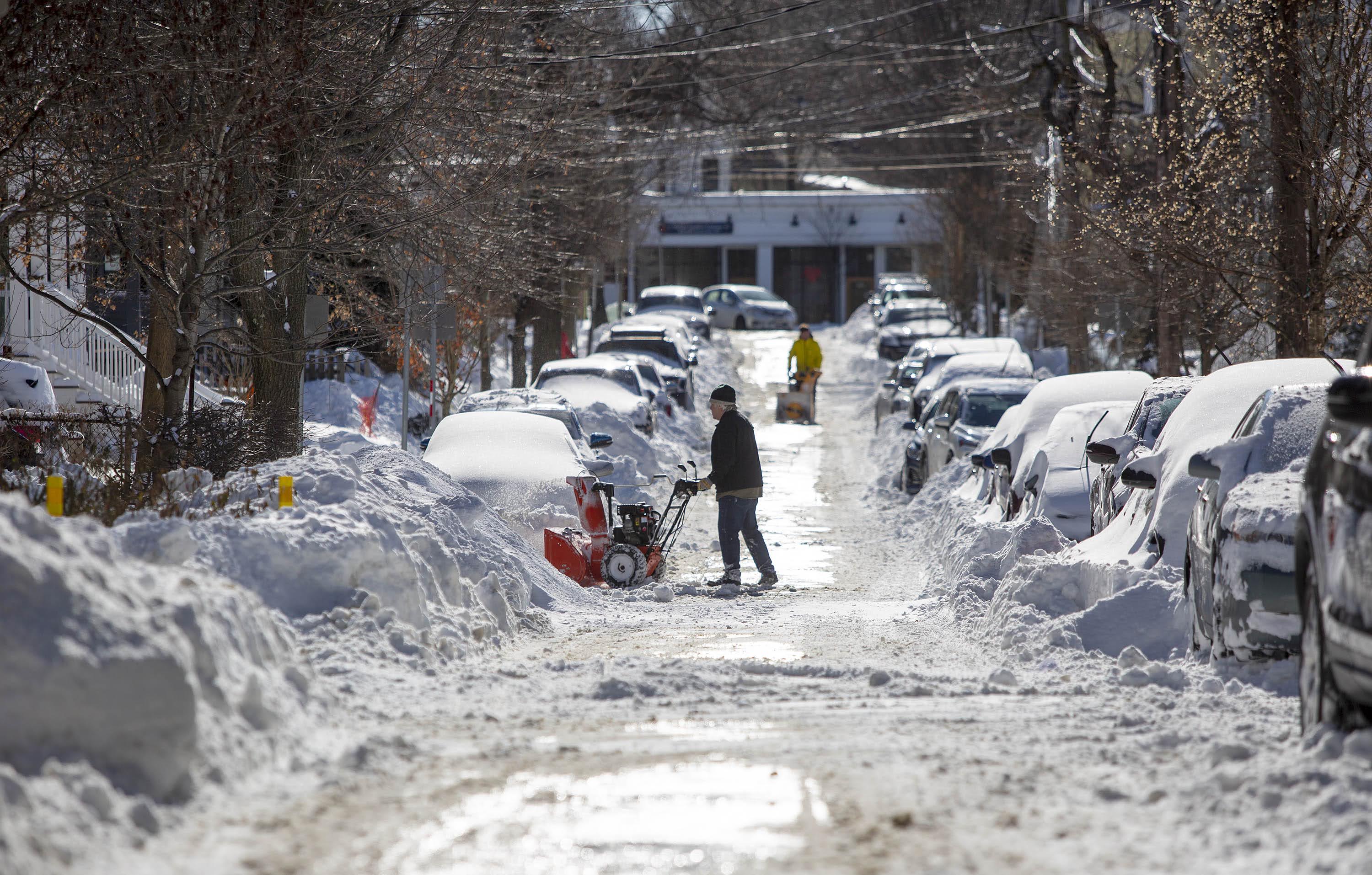 Snowblowers out on the streets of Cambridge as the clean up from the weekend's storm begins. (Robin Lubbock/WBUR)