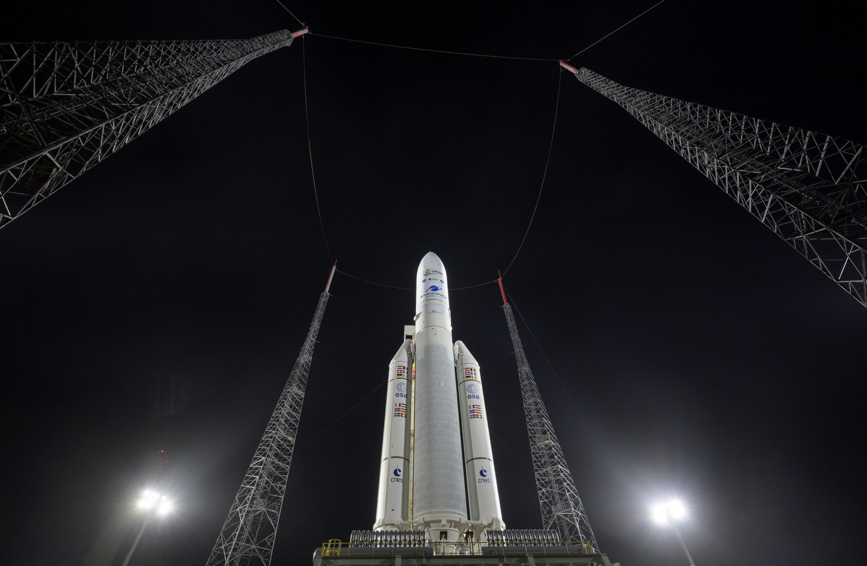 In this photo provided by NASA, Arianespace's Ariane 5 rocket with NASA's James Webb Space Telescope onboard, is seen at the launch pad on Dec. 23, 2021, at the Guiana Space Center in French Guiana. The James Webb Space Telescope has infrared vision, allowing it to peer deeper into the universe, all the way to the first stars and galaxies. (Bill Ingalls/NASA via AP)