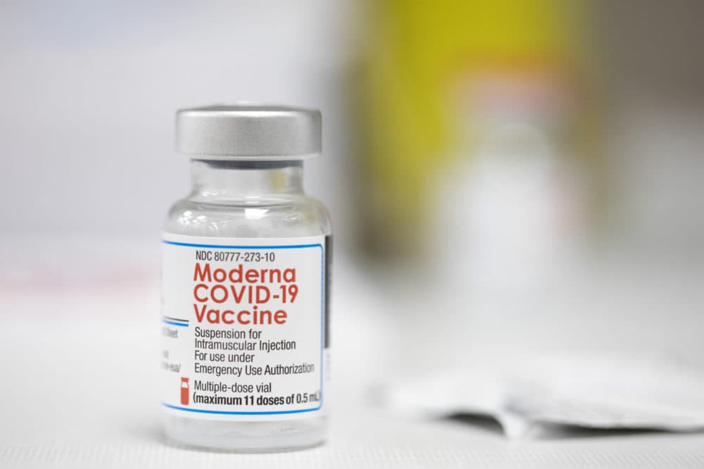 A vial of the Moderna COVID-19 vaccine is displayed on a counter at a pharmacy in Portland, Ore., on Dec. 27, 2021. (Jenny Kane/AP)