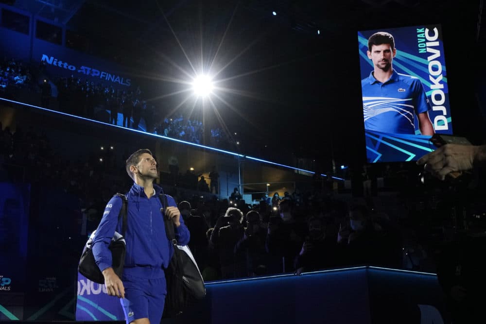 Serbia's Novak Djokovic enters the field of play prior to play against Norways' Casper Ruud during their ATP World Tour Finals singles tennis match, at the Pala Alpitour in Turin, Nov. 15, 2021. (Luca Bruno/AP)