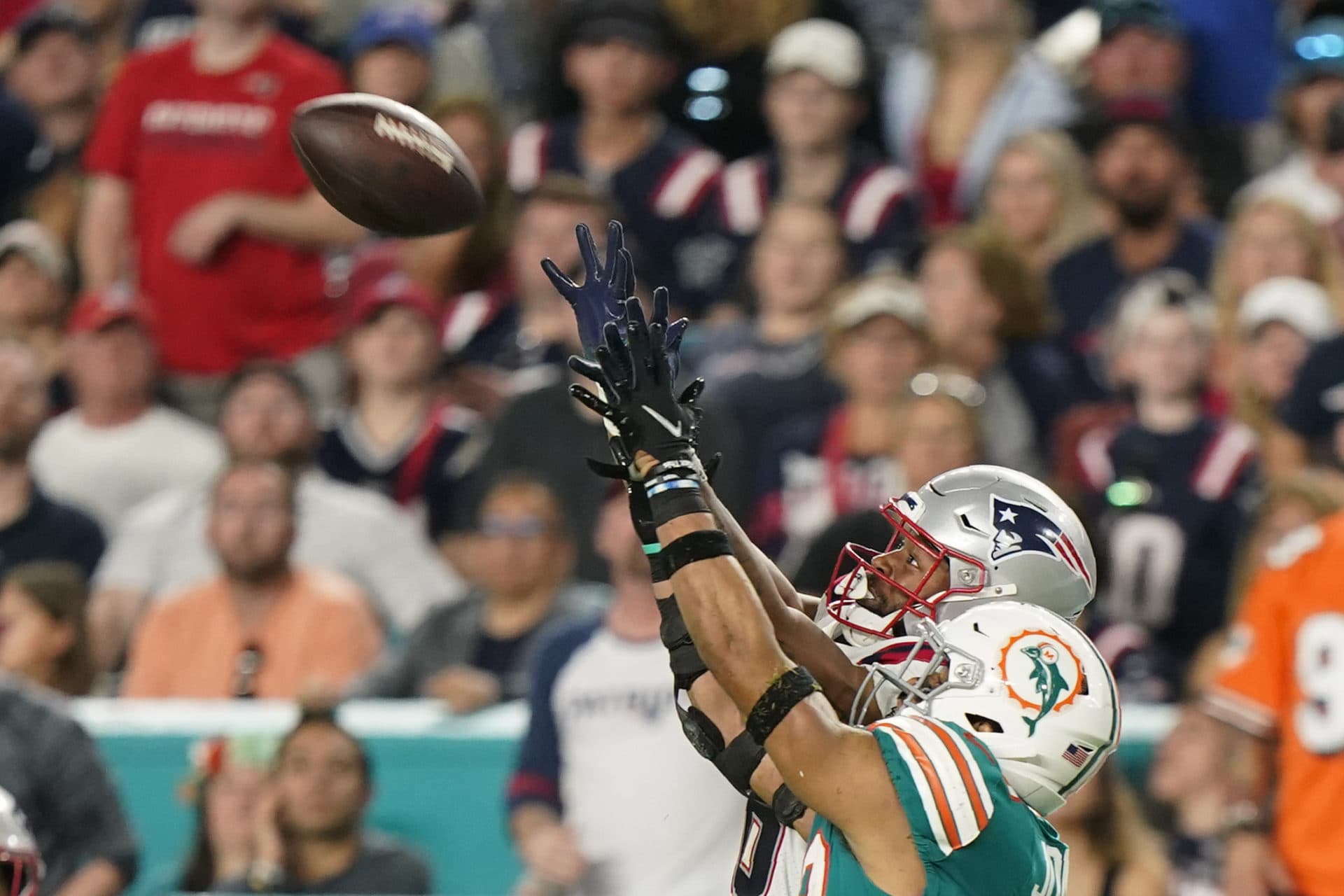 New England Patriots wide receiver Jakobi Meyers (16) makes a catch past the defense of Miami Dolphins safety Brandon Jones (29) during the second half of the game. (Wilfredo Lee/AP)