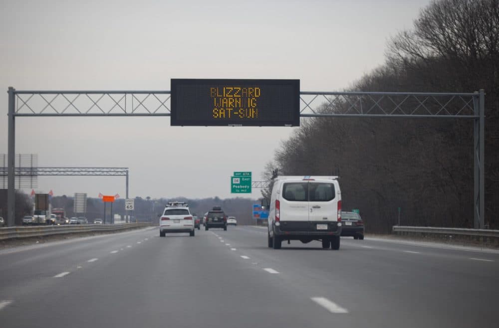 A Department of Transportation information sign on Route 95 in Danvers warning drivers of the storm coming on Saturday. (Jesse Costa/WBUR)