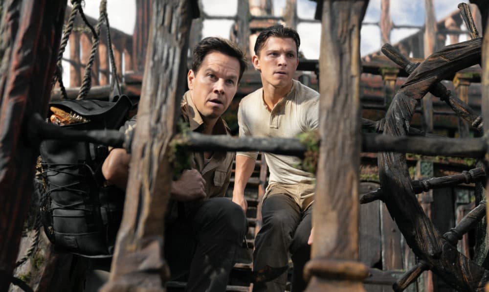 Victor &quot;Sully&quot; Sullivan (Mark Wahlberg, left) and Nathan Drake (Tom Holland) look to make their move in &quot;Uncharted.&quot; (Clay Enos/Sony Pictures)