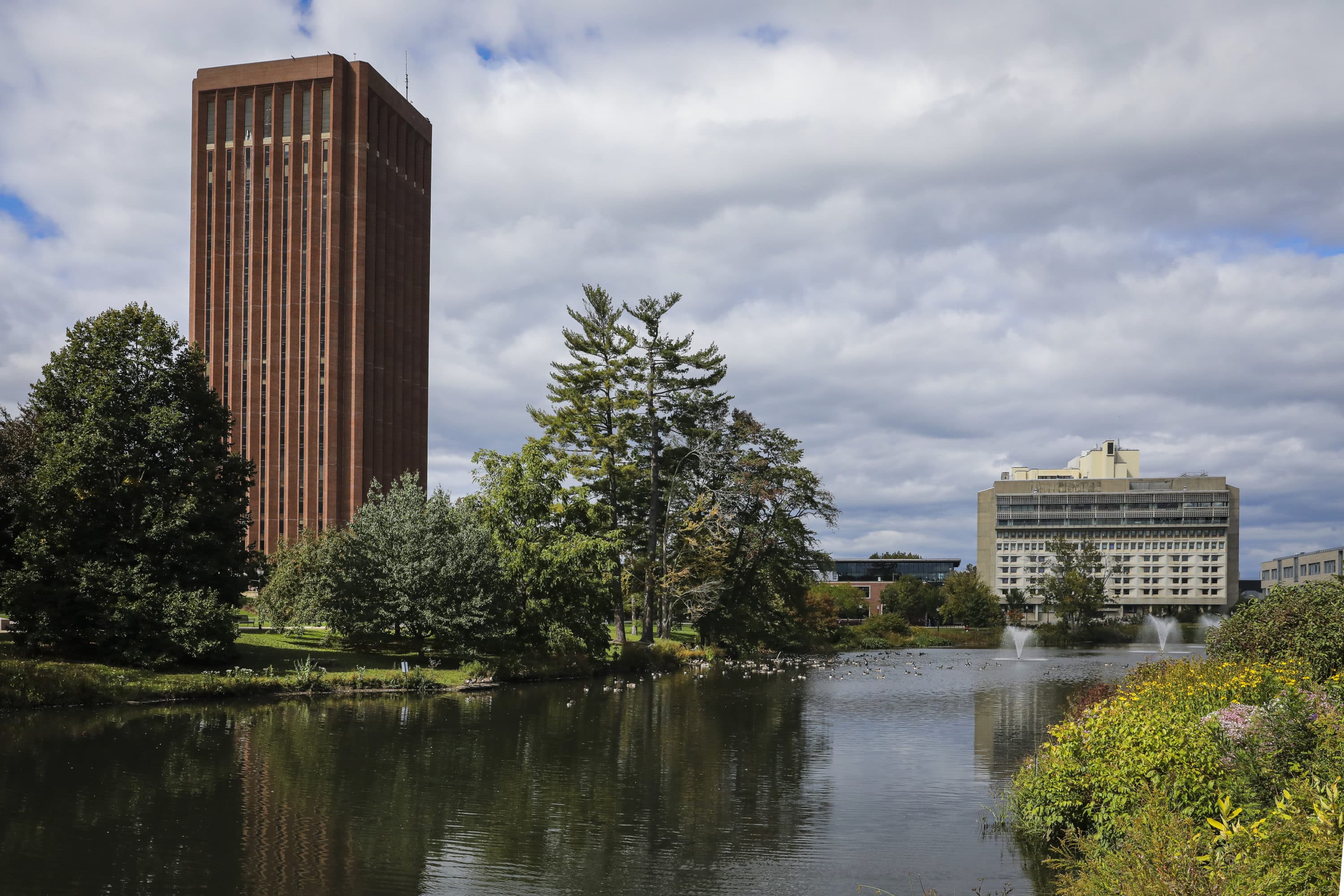 W. E. B. Du Bois Library and the Integrative Learning Center are seen across the Campus Pond at UMass Amherst in Amherst. (Erin Clark/The Boston Globe via Getty Images)