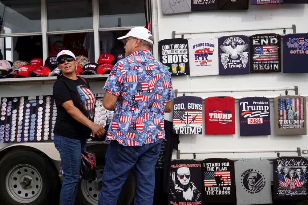 Guests shop for merchandise before the start of a rally with former President Donald Trump at the Iowa State Fairgrounds on October 09, 2021 in Des Moines, Iowa. (Scott Olson/Getty Images)