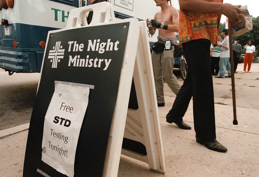 A sign is posted outside The Night Ministry bus on Aug. 9, 2000 in the Uptown neighborhood of Chicago, informing citizens of the free STD testing offered by The Outreach and Health Ministry program. The Night Ministry reaches out to individuals who are living on the streets, many of whom do not have access to social services. (Tim Boyle/Newsmakers/Getty Images)