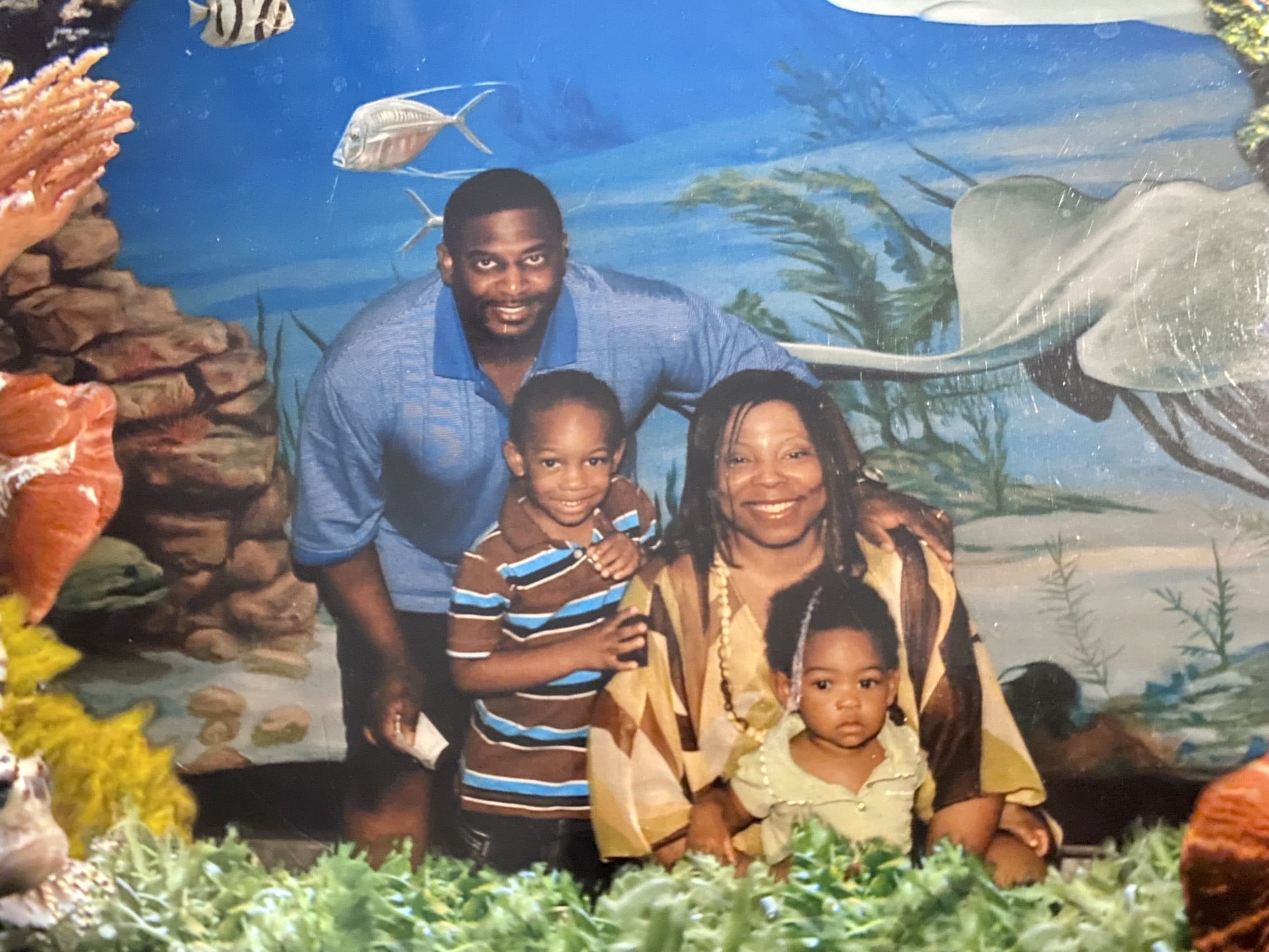An old family photo of Trina and Martin Daniel, who died of COVID-19 within 24 hours of one another in July, with their children Myles and Marina, who were adopted by their cousins after their parents died. Myles and Marina are now teenagers. (Courtesy of the Daniel family)